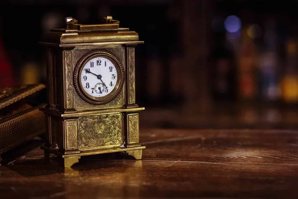 Ornate Brass Mantel Clock with Decorative Enamel Dial