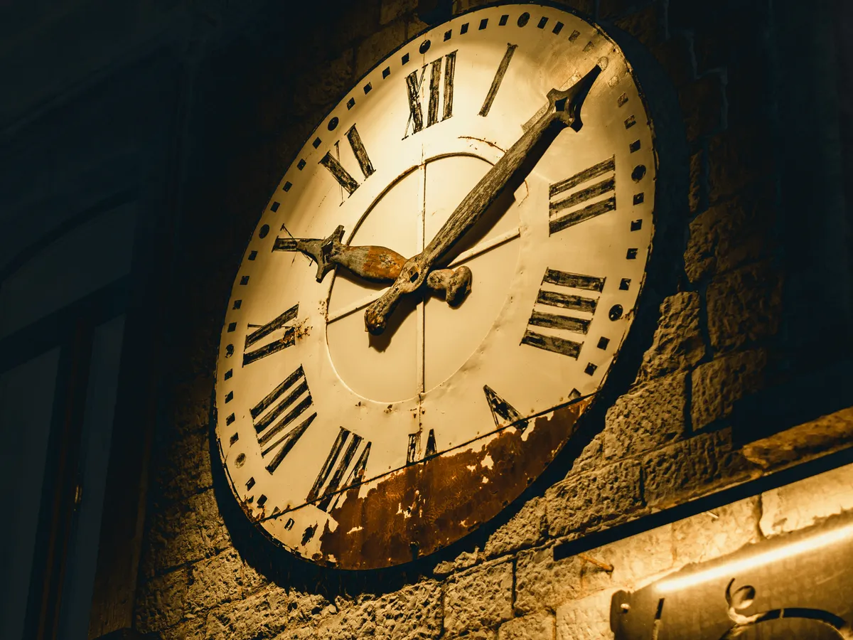 Antique Roman Numeral Wall Clock with Ornate Brass Hands